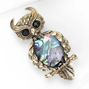 Vintage owl brooch with abalone shell inlay and rhinestones on a gold alloy branch