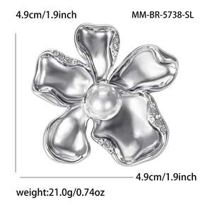 Polished silver flower brooch with crystal petals and center pearl detail