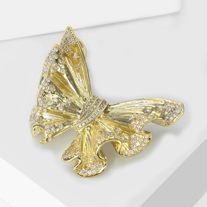 Luxurious gold butterfly brooch with shimmering pavé zircon stones on wave wings