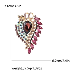 Macro view of vintage alloy brooch showing detailed dimensions and large waterdrop gem