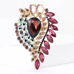 Detailed macro shot of vintage alloy brooch with brown pear-shaped rhinestones