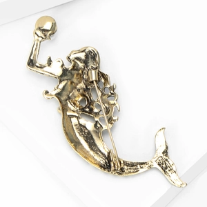 Detailed back view of vintage gold mermaid brooch featuring secure pin clasp and textures
