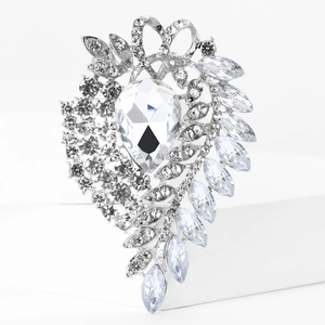 Detailed macro view of pear-cut crystal and rhinestones on a vintage silver flower brooch