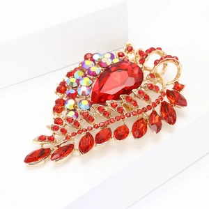 Elegant gold alloy leaf brooch with large red teardrop gem and sparkling crystals