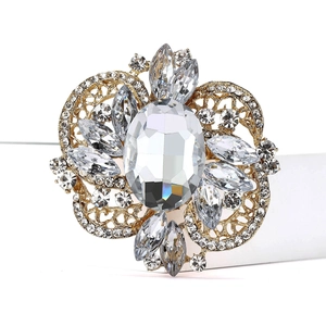 Macro view of vintage alloy brooch with large oval crystal and marquise stones