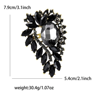 Elegant leaf crystal brooch with rhinestones and gems in grey and gold finish