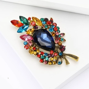 Eleganter Tropfen-Brosche in Blau mit Vintage-Gold-Finish und bunten Strasssteinen