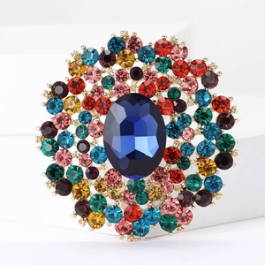 Detailed macro view of large luxury alloy brooch with vibrant colorful crystals