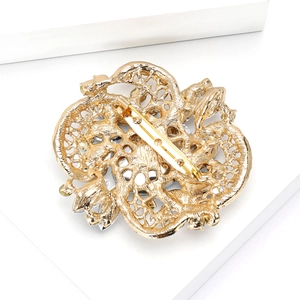 Detailed back view of gold alloy brooch showing the intricate镂空craftsmanship and pin lock