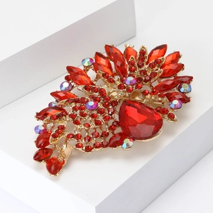 Elegant gold alloy brooch with large red waterdrop crystals and sparkling diamonds