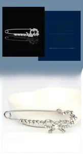 Détails de broches épingles de sûreté argentées avec couronne et nœud en cristal