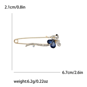Broche épingle à nourrice paon élégante avec cristaux bleus et spécifications