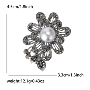 Broche rose vintage en métal noir avec perle nacrée et strass hauteur de 4.5cm