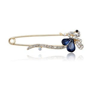 Broche épingle dorée élégante avec cristaux bleu foncé et zircons blancs scintillants