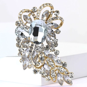Macro detail of luxury vintage brooch with crystals and gold-plated alloy base