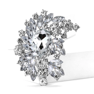 Macro view showing large pear-cut glass stone and marquise crystals on alloy brooch base