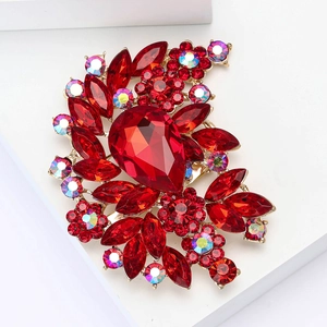 Vintage gold alloy flower brooch with large red teardrop gemstone and crystals