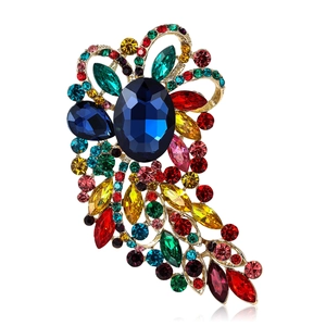 Exquisite gold alloy brooch with vintage colorful crystals and large blue gemstone