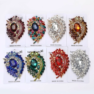 Detailed set of 8 alloy paisley brooches with colorful rhinestones on cards