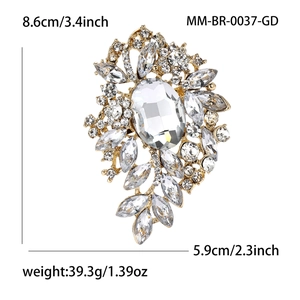 Lujoso broche de flor dorado con pedrería y cristales mide 8,6 cm por 5,9 cm