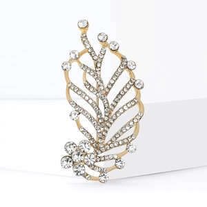 Elegant gold leaf brooch with sparkling white rhinestones and delicate floral base