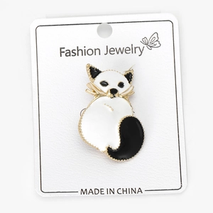 Detail of fox-shaped enamel brooch pinned on a white Fashion Jewelry display card