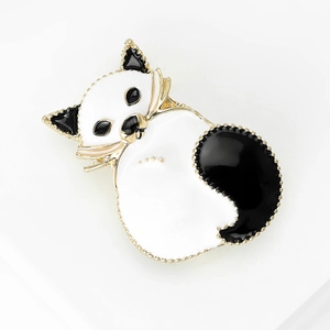 Chic black and white enamel cat brooch with gold plating and small pearl accents