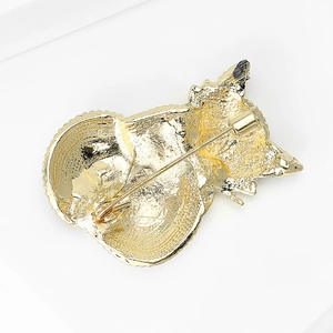 Golden fox brooch back view featuring metal texture and secure safety pin closure