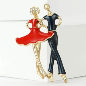 Detail of elegant couple dancing brooch featuring red enamel and sparkling rhinestones