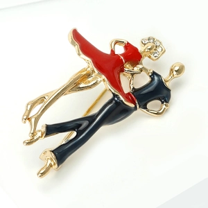 Elegant dancing couple brooch in gold alloy with red enamel dress and white rhinestones