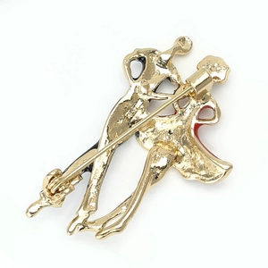 Detailed back view of golden couple dancing brooch with secure pin clasp and textured finish
