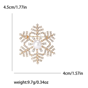 Golden snowflake brooch featuring a central white pearl and sparkling rhinestones