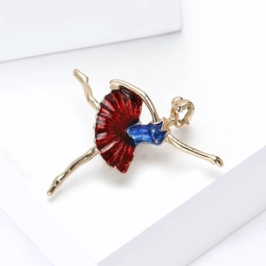 Elegant gold-plated ballet dancer brooch with red and blue enamel in a leaping pose