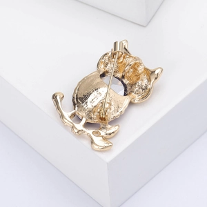 Detailed back view of the owl brooch showing the secure golden pin fastener mechanism