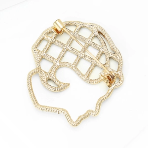 Golden hollow human silhouette brooch pin with detailed medical brain profile back
