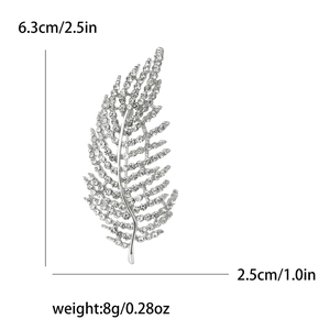 Dimensions détaillées de la broche feuille en strass argenté : 6,3 cm de haut et 2,5 cm