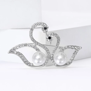 Elegant silver double swan brooch with shimmering rhinestones and white pearls