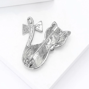 Silver cat brooch back detail showing secure safety pin clasp and hollow bow knot