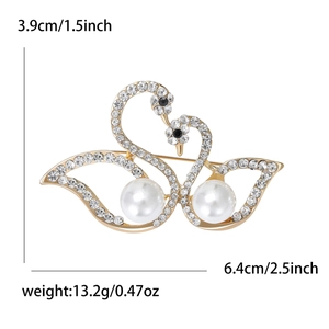 Elegant gold double swan brooch with rhinestones and white pearls, 6.4cm width