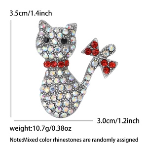 Cat brooch with silver finish, rhinestones, and red bow tie details, 3.5cm x 3.0cm