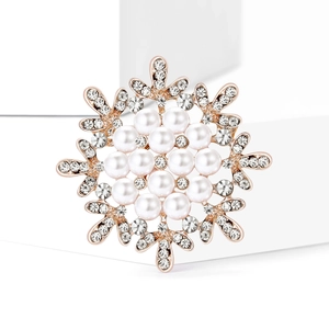 Elegant rose gold snowflake brooch with white pearls and sparkling clear rhinestones