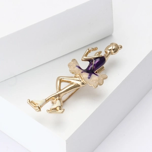 Elegant gold rhythmic gymnastics girl brooch with purple enamel on a white geometric base