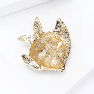 Golden Kuromi metal brooch showing the textured back and classic safety pin clasp mechanism