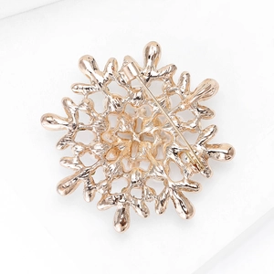 Detail view of the rose gold snowflake brooch back with secure pin clasp closure