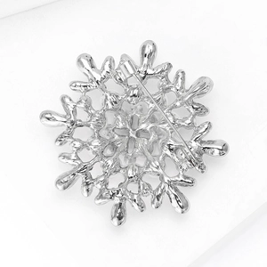 Detailed back view of the silver snowflake brooch showing the clasp and hollow structure