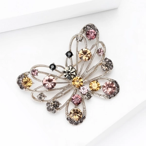 Exquisite butterfly brooch with colorful rhinestones in a silver filigree metal frame
