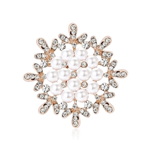 Elegant snowflake brooch with white faux pearls and crystals on rose gold finish