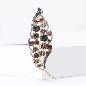 Elegant leaf brooch with multi-colored rhinestones and champagne gold metal finish