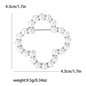 Detailed view of 4.3cm pearl clover brooch with silver alloy base and secure pin backing