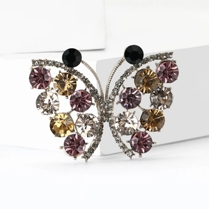 Exquisite butterfly brooch with colorful rhinestones on white minimalist display stand